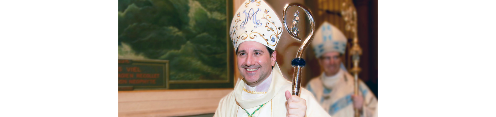 Bishop Francis Leo wearing a mitre and holding his staff